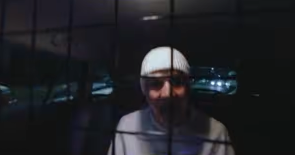 Richard driving Vincent in police van