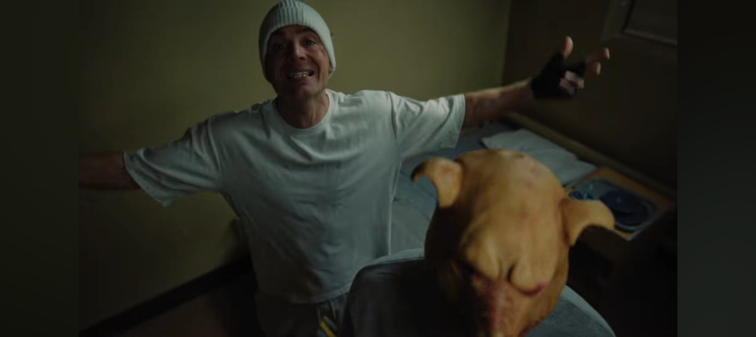 Vincent wearing pig mask in prison cell - Orwellian symbolism