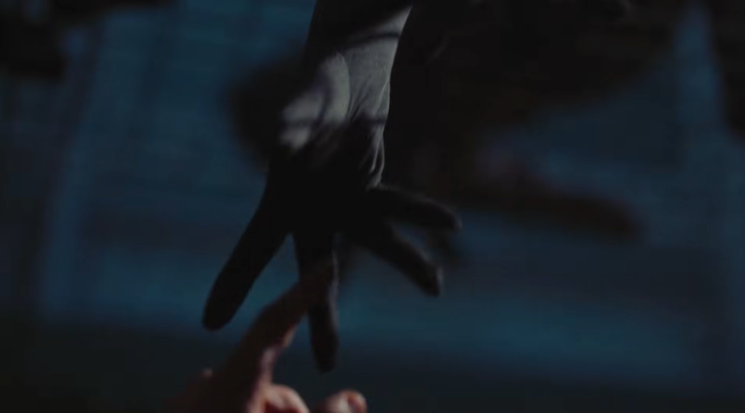 Hands reaching during sentient beings lyric - visual echoes of connection and creation