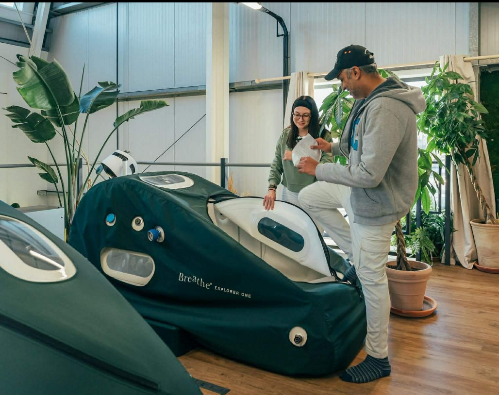 A member preparing to enter a Breathe Explorer One hyperbaric chamber at the Breathe clinic in Southwick, Brighton